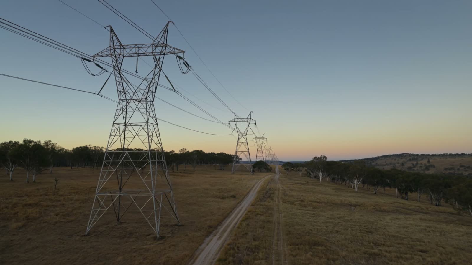Electricity transmission lines crossing a rural landscape