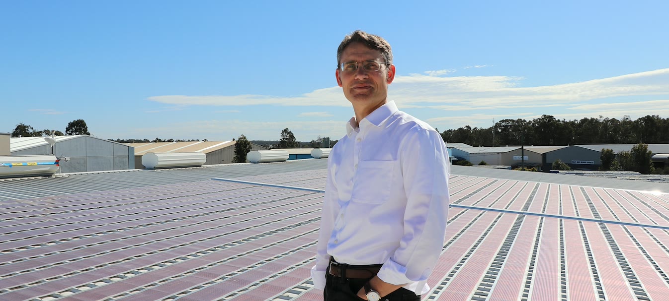 Professor Paul Dastoor on a roof covered in Printed Solar