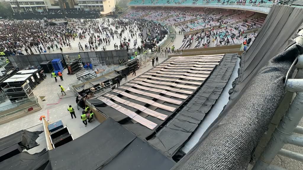 Crew lifting Printed Solar off the stands for the next venue