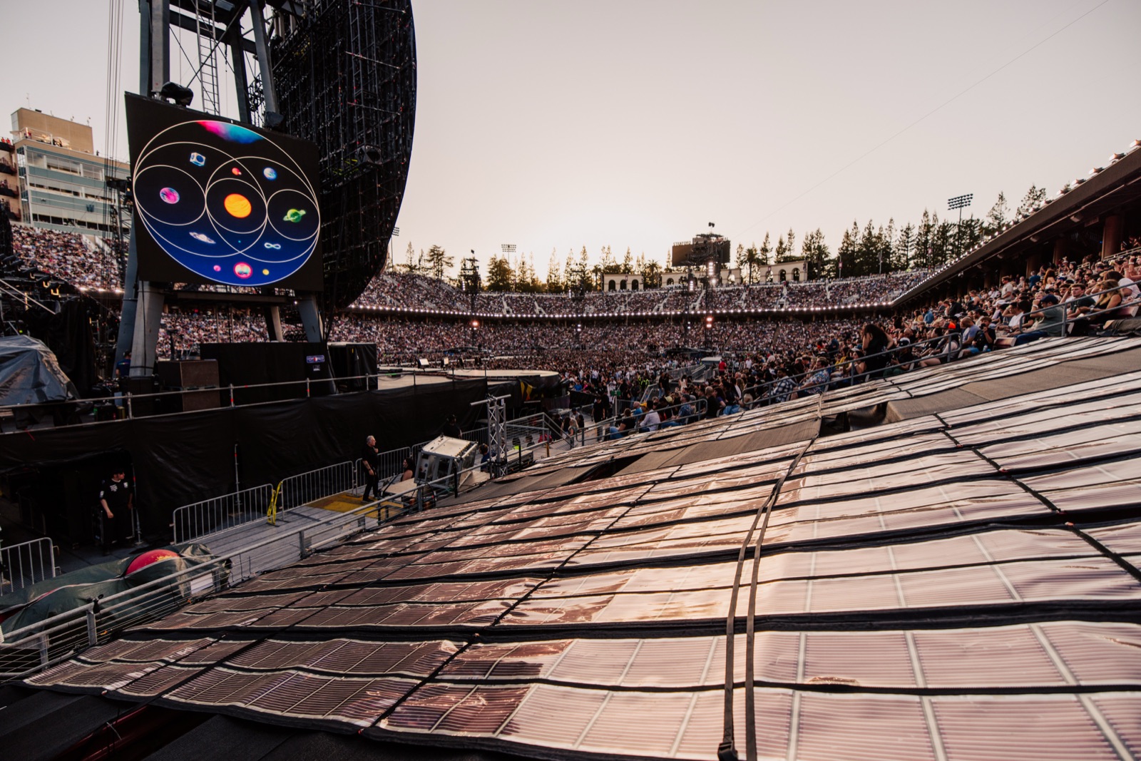 Printed Solar on the stands at Stanford Stadium with the stage screen behind