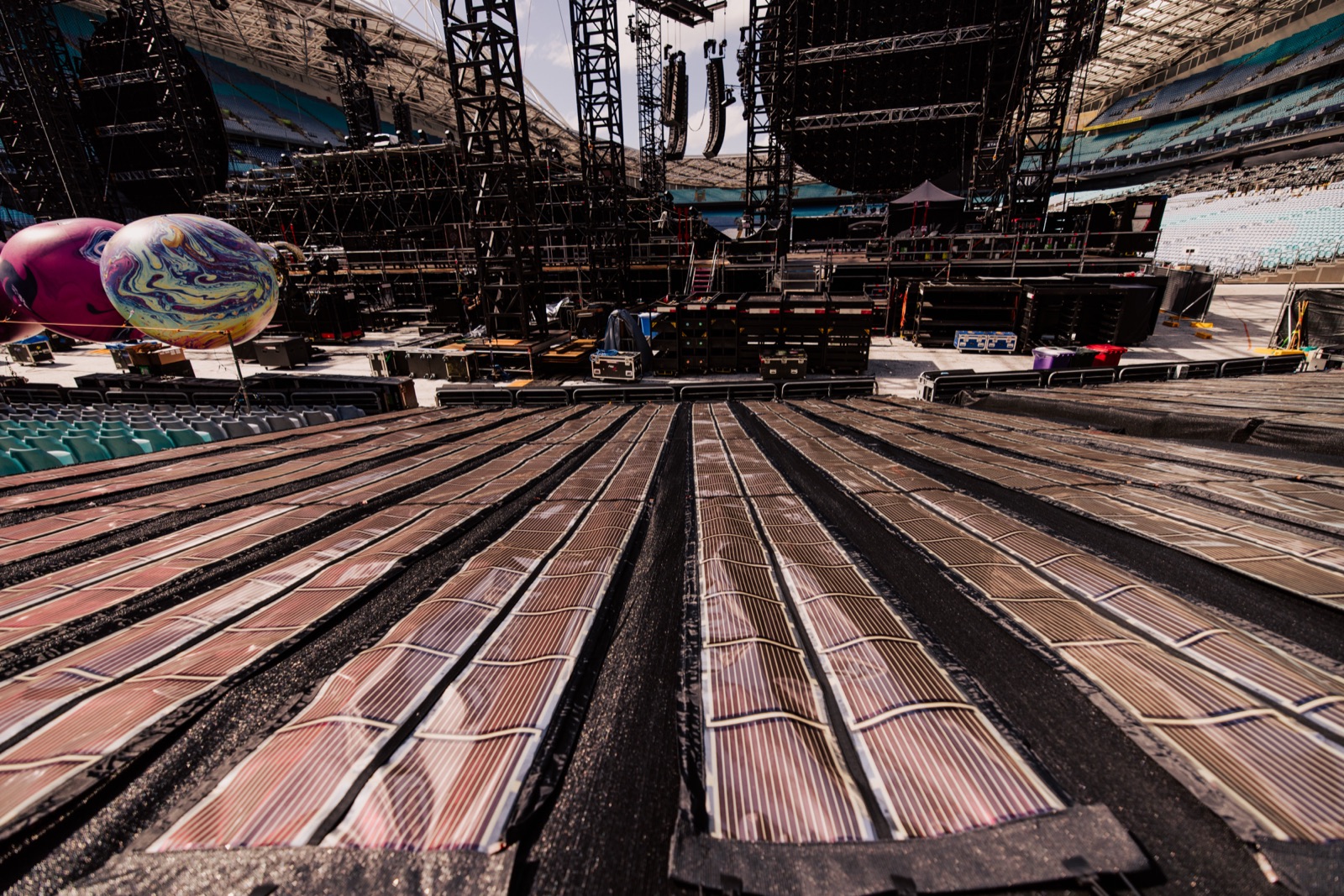 Rows of Printed Solar across stadium seating facing the stage on the Music of the Spheres World Tour